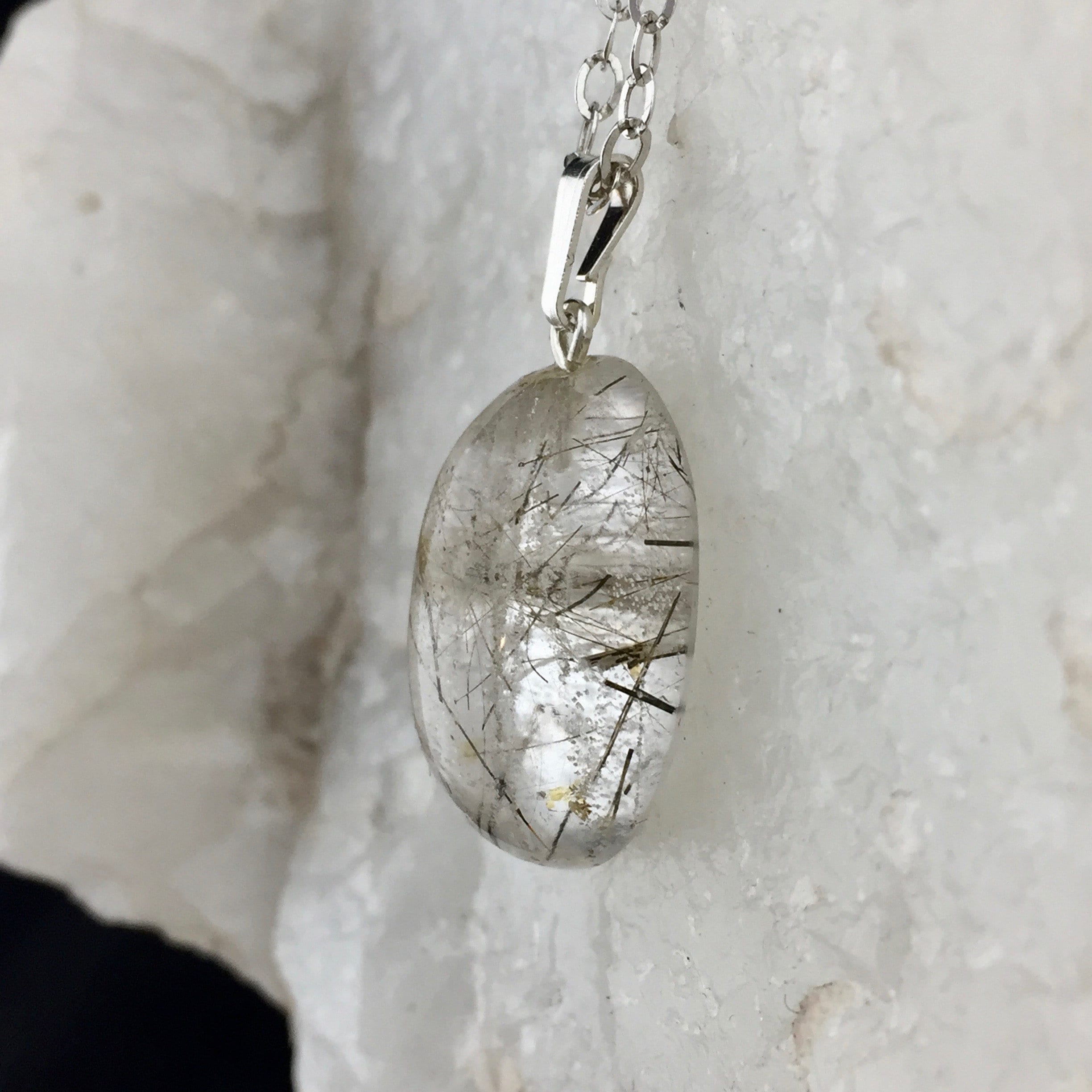 An Illumineer: Rutile Quartz Crystal And Sterling Silver Pendant (1-5)