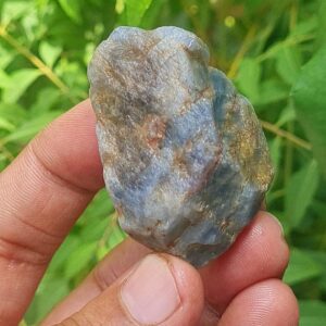 Raw Blue Sapphire Specimen: Reiki Healing Crystal (267 Ct, 44x23 Mm) Raw Blue Sapphire Specimen: Reiki Healing Crystal (267 Ct, 44x23 Mm)