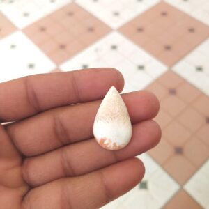 Orange Scolecite Cabochon: Pear Gemstone 18 Carat (30x18x5 Mm) Orange Scolecite Cabochon: Pear Gemstone 18 Carat (30x18x5 Mm)
