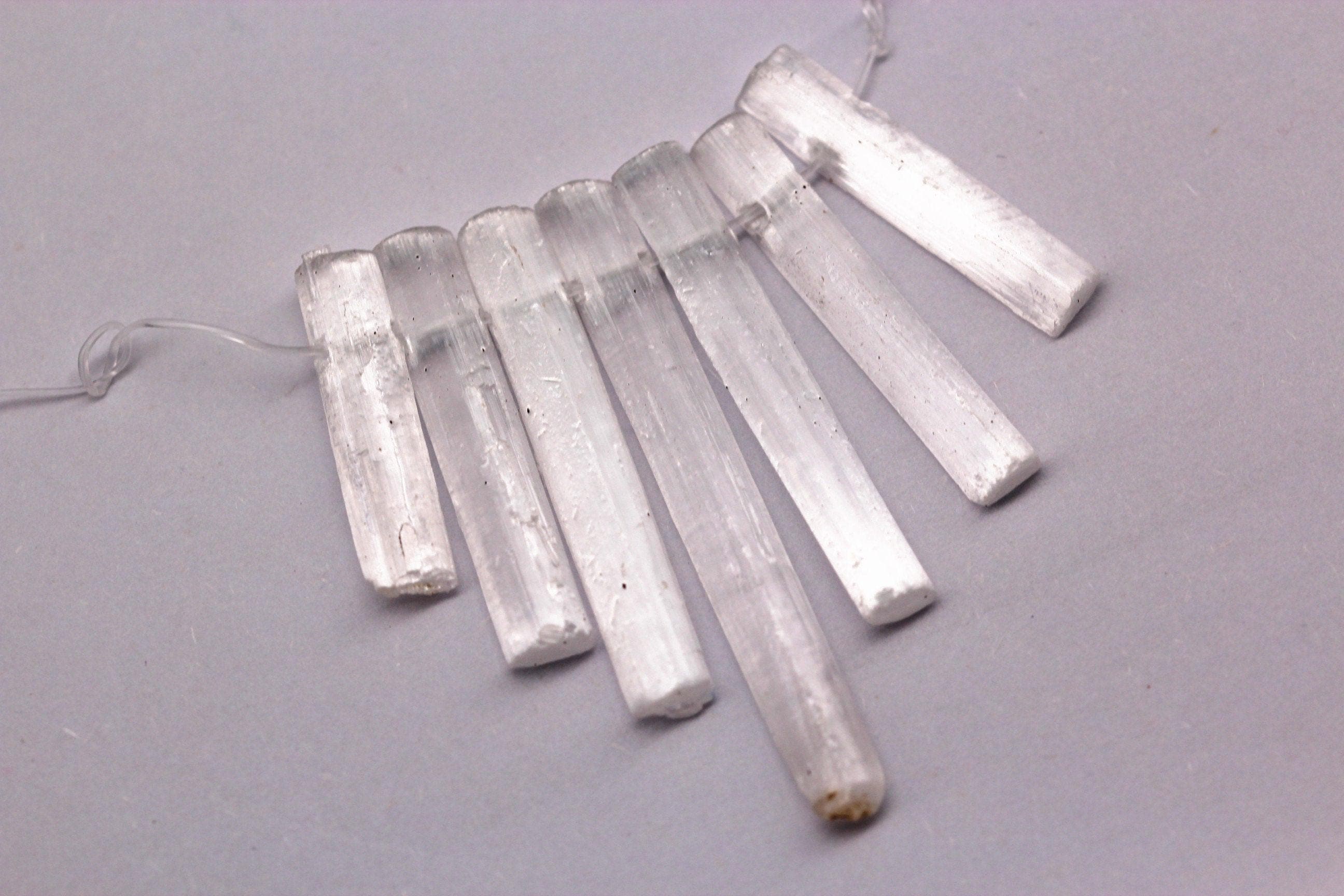 Natural Selenite Graduated Slice Stick Points Beads 30-50mm 7 Pcs / Set Natural Selenite Graduated Slice Stick Points Beads 30-50mm 7 Pcs / Set