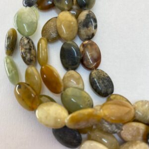 10x14mm Oval New Jade Gemstone Beads. 15” strand of mixed brown and green oval beads, 30 per strand. Rainbow Serpentine. Flower Jade. 10x14mm Oval New Jade Gemstone Beads. 15” strand of mixed brown and green oval beads, 30 per strand. Rainbow Serpentine. Flower Jade.
