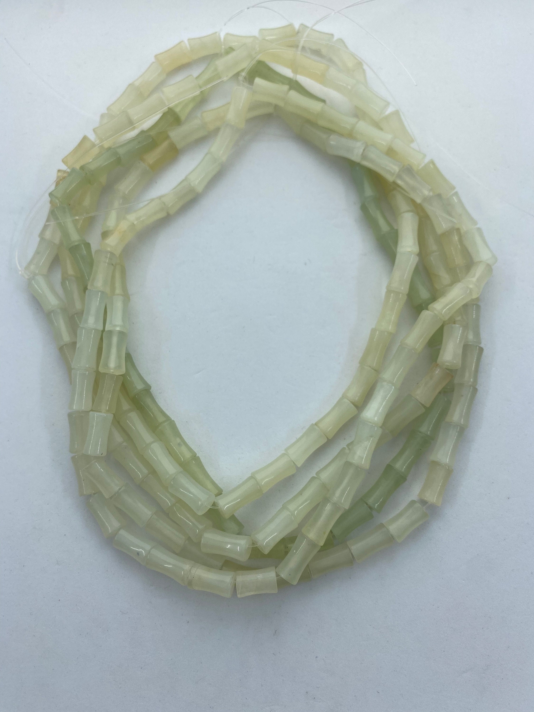 6x12mm Bamboo Shaped Serpentine Gemstone Beads. 15” Strand Of Light Green Beads, About 34 Per Strand. Light Celery Green "jade" 6x12mm Bamboo Shaped Serpentine Gemstone Beads. 15” Strand Of Light Green Beads, About 34 Per Strand. Light Celery Green "jade"