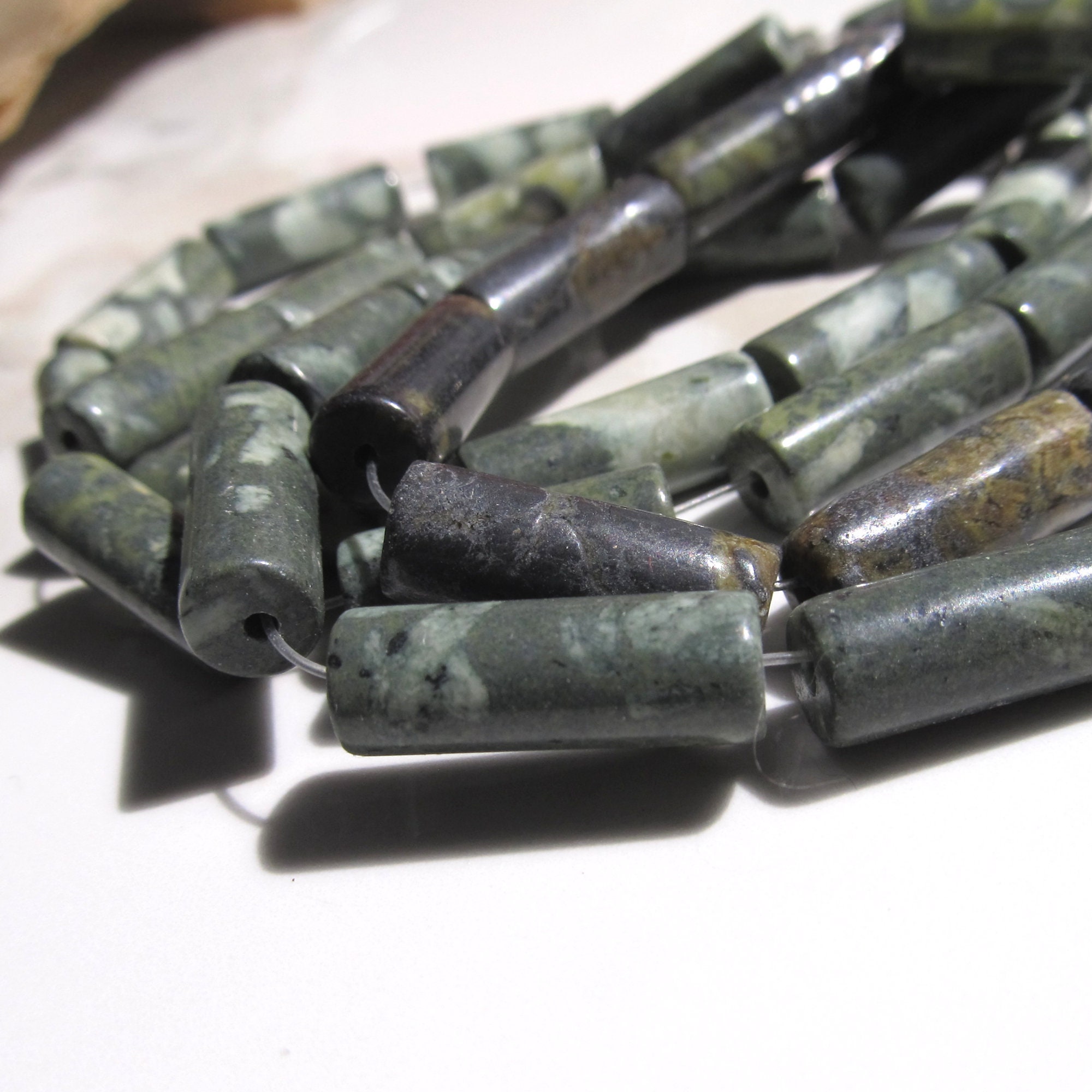 Olive Green Serpentine Tube Beads: African Snake Skin Gemstone (10 Pieces) Olive Green Serpentine Tube Beads: African Snake Skin Gemstone (10 Pieces)
