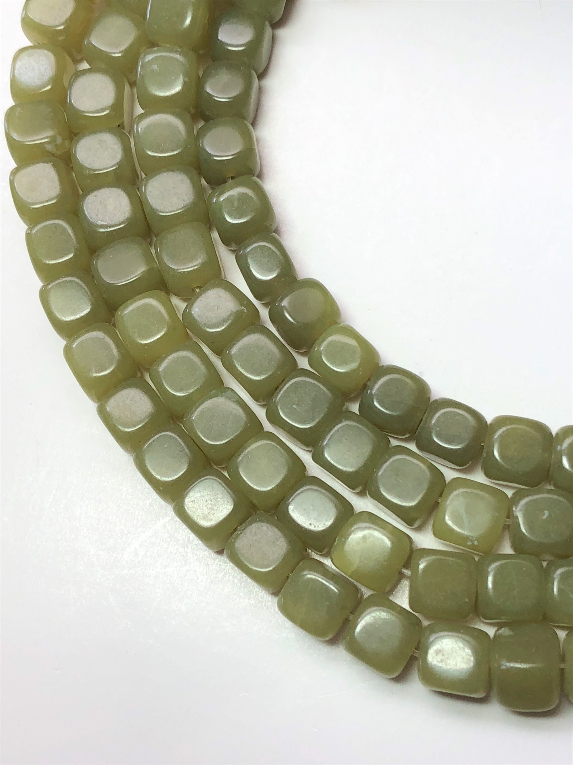 7mm Cube Yellow/green Serpentine Gemstone Beads. Full 15" Strand Of Slightly Irregular Cubes With Rounded Edges. Also Called New Jade. 7mm Cube Yellow/green Serpentine Gemstone Beads. Full 15" Strand Of Slightly Irregular Cubes With Rounded Edges. Also Called New Jade.