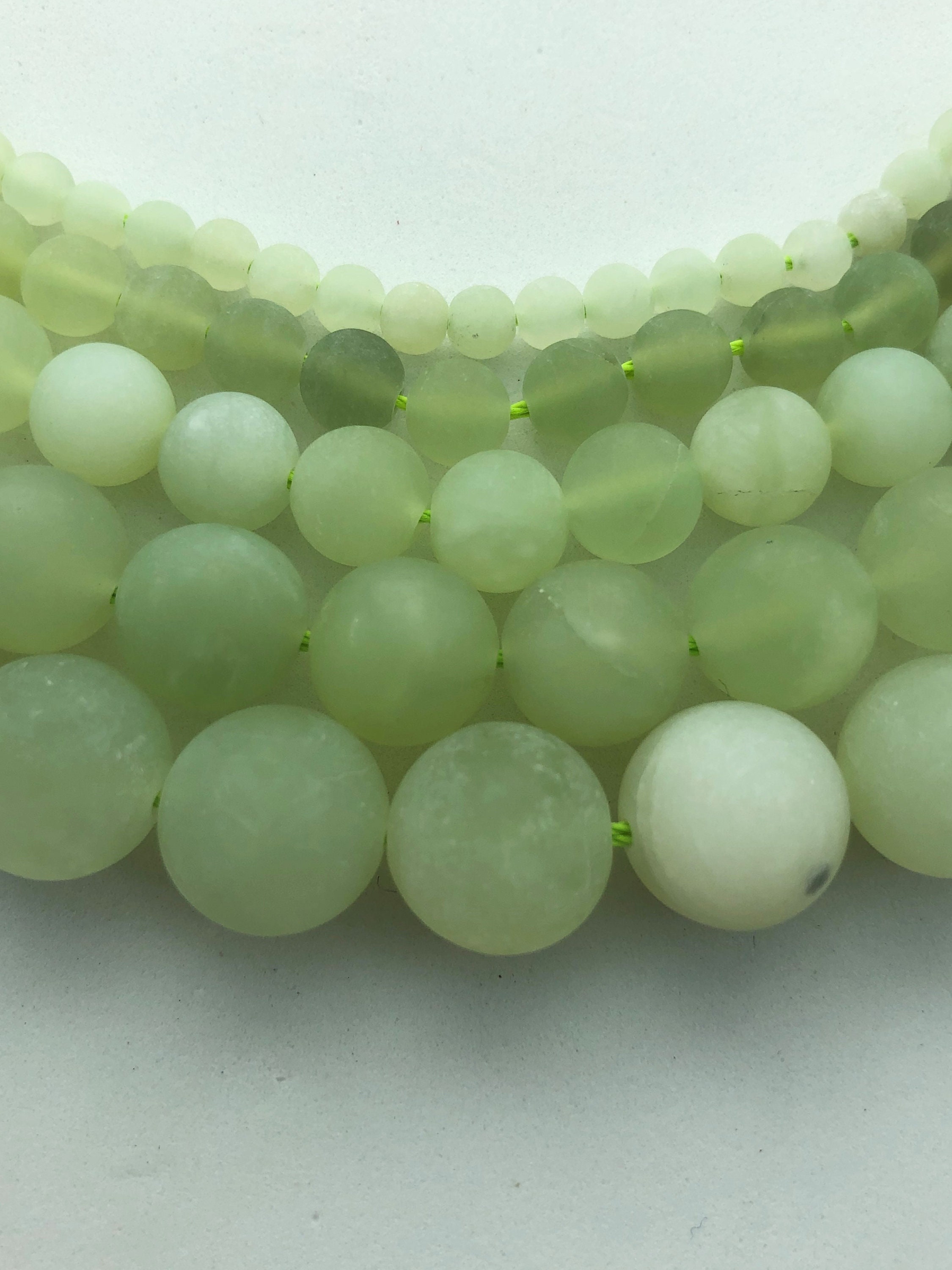 Matte Serpentine Gemstone Beads. Full 15" Strand Of A Grade Round Beads, Available 4-12mm. Light Green "jade". Also Called New Jade. Matte Serpentine Gemstone Beads. Full 15" Strand Of A Grade Round Beads, Available 4-12mm. Light Green "jade". Also Called New Jade.