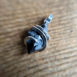 Faceted snowflake obsidian in sterling silver pendant