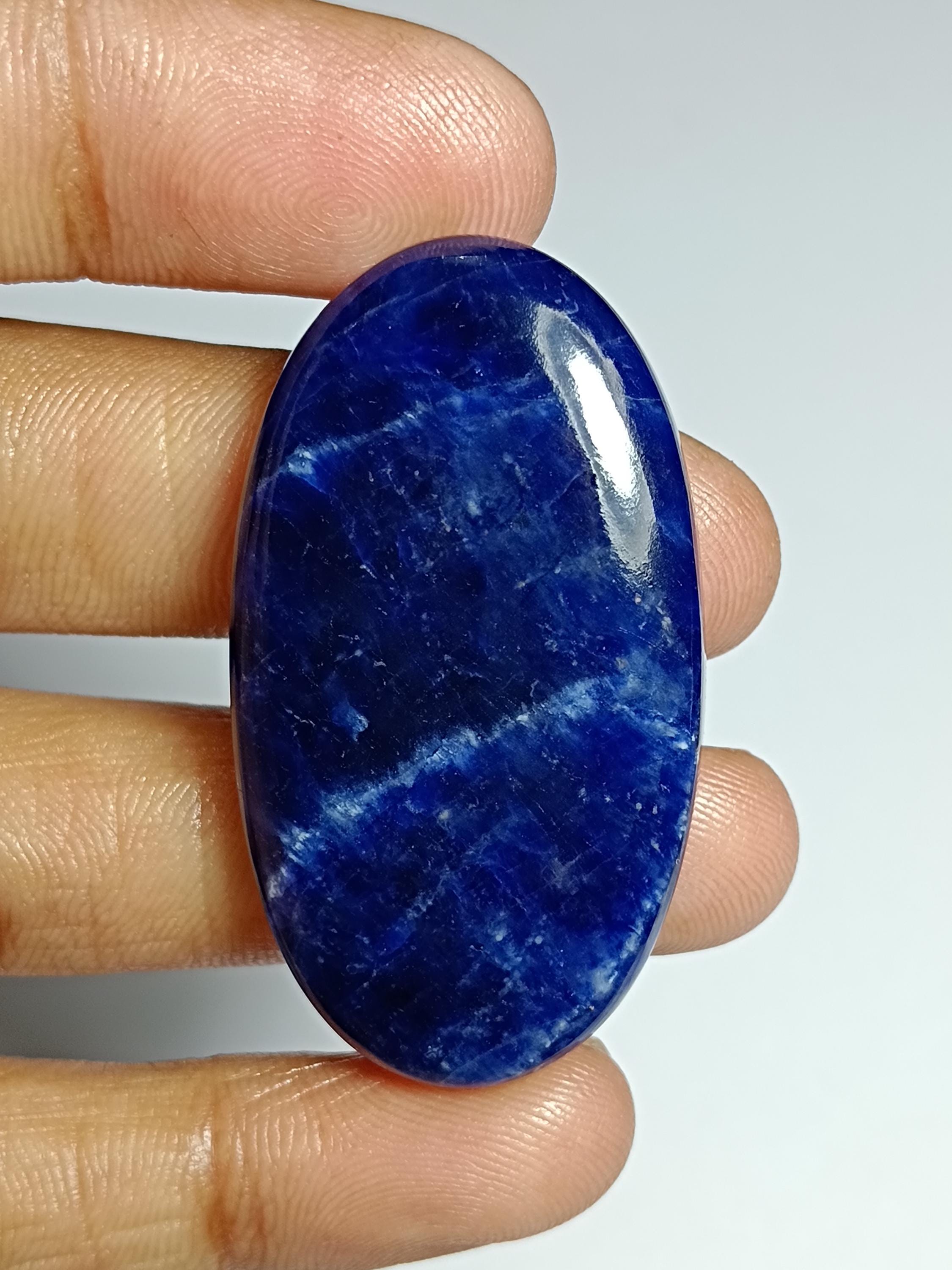 Sodalite Cabochon: Semi Precious Loose Gemstone (45x25 Mm, 62cts) Sodalite Cabochon: Semi Precious Loose Gemstone (45x25 Mm, 62cts)