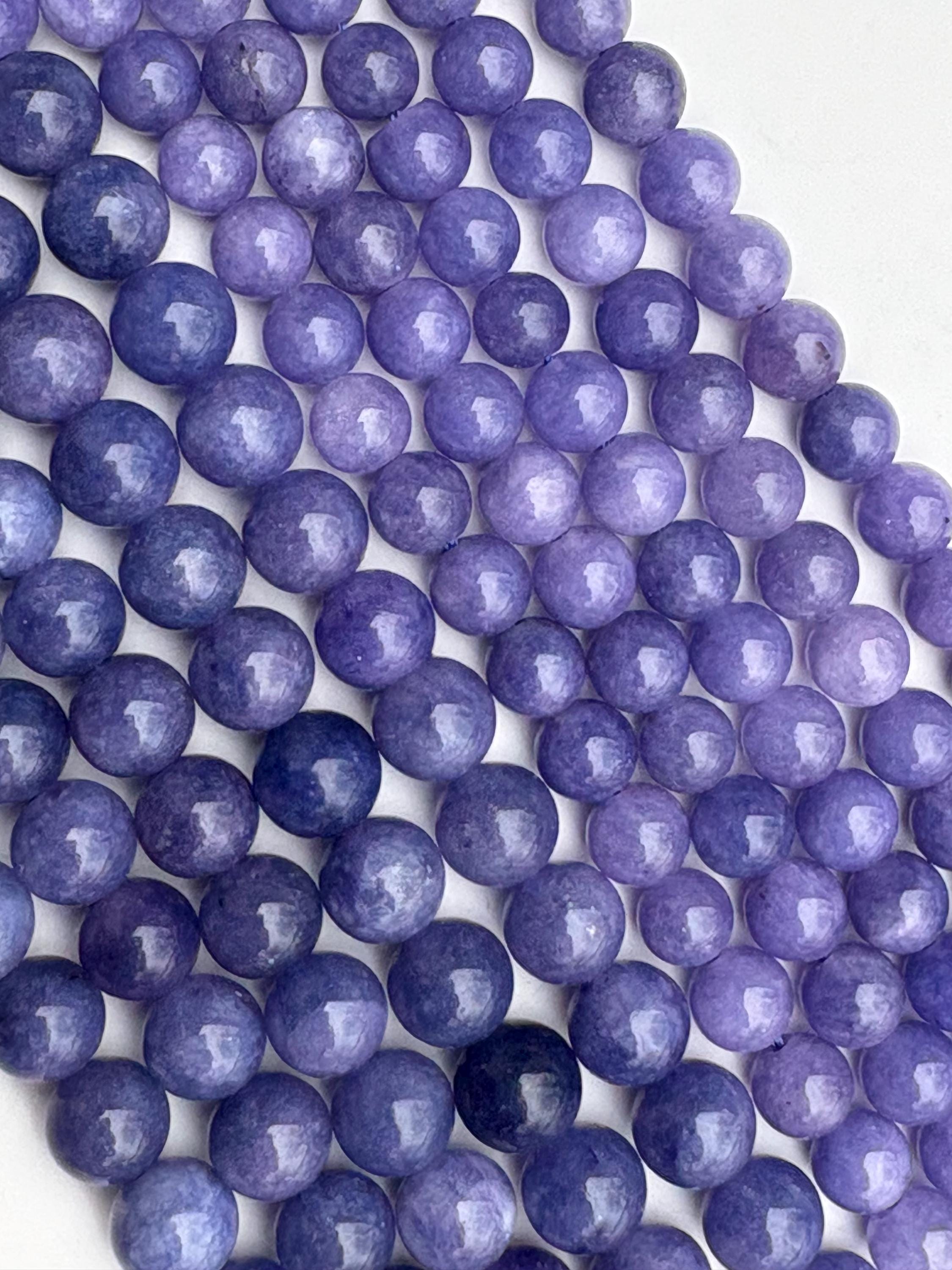 Blue “tanzanite” Chalcedony Gemstone Beads. 15" Strand High Quality Round Beads, Available 8-10mm. Dyed Tanzanite Colored “jade”. Blue “tanzanite” Chalcedony Gemstone Beads. 15" Strand High Quality Round Beads, Available 8-10mm. Dyed Tanzanite Colored “jade”.