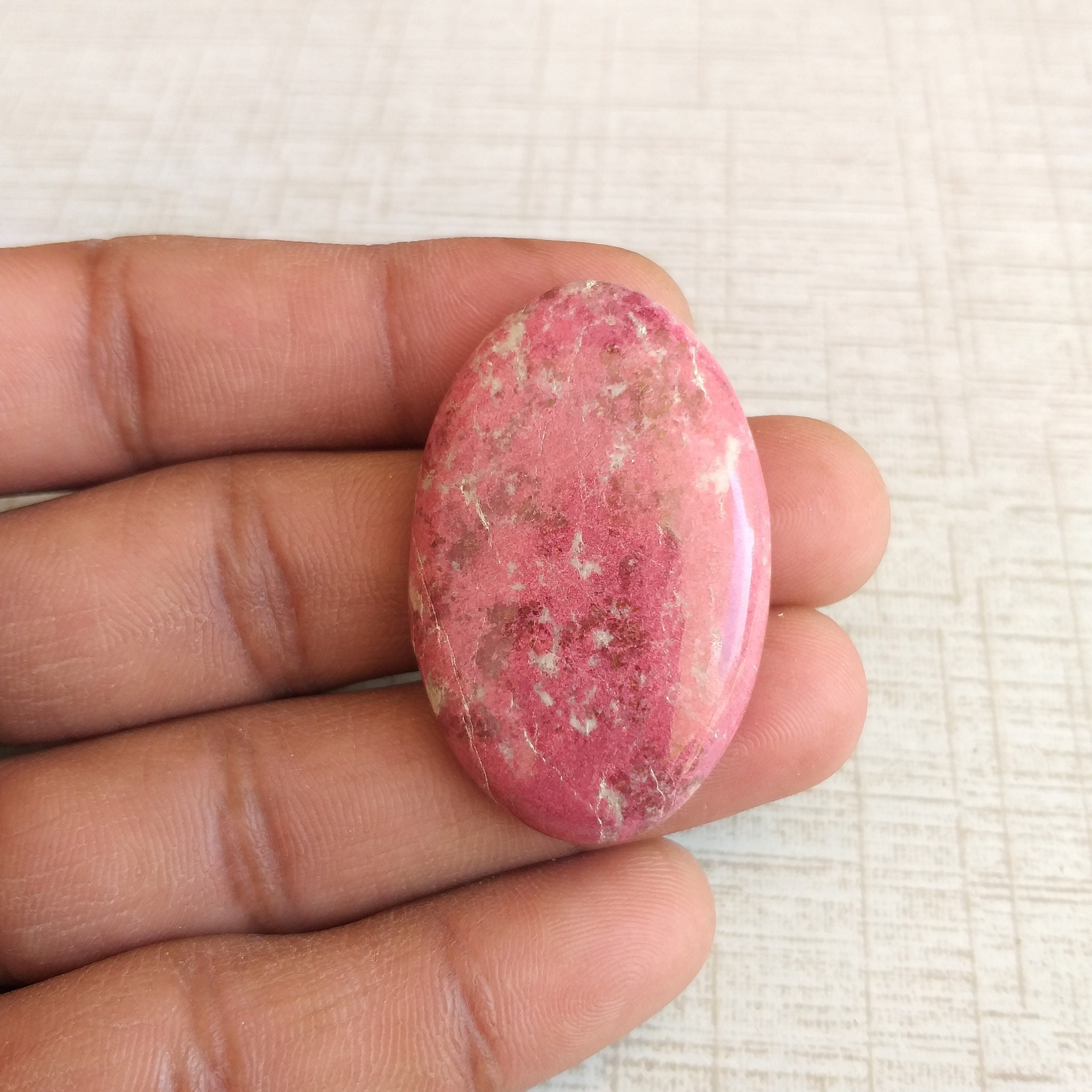 Oval Thulite Stone Cabochon: 76.9 Carat Gemstone (42x27x7 Mm