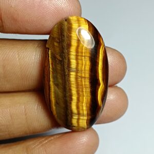 Handmade Tiger Eye Cabochon: Semi Precious Loose Stone (41ct, 35x19 Mm) Handmade Tiger Eye Cabochon: Semi Precious Loose Stone (41ct, 35x19 Mm)