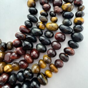 8-12mm Nugget Mixed Tiger Eye Gemstone Beads. 15” strand of free form Tiger Eye beads. Brown, red and blue mix. 8-12mm Nugget Mixed Tiger Eye Gemstone Beads. 15” strand of free form Tiger Eye beads. Brown, red and blue mix.