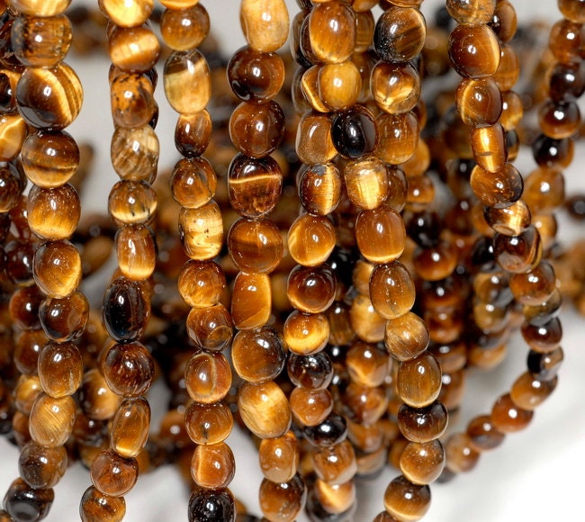 Cognac Tiger Eye Gemstone Yellow 8x6-7x5mm Pebble Nugget Loose Beads 15.5 Inch Full Strand (90191777-b66) Cognac Tiger Eye Gemstone Yellow 8x6-7x5mm Pebble Nugget Loose Beads 15.5 Inch Full Strand (90191777-b66)