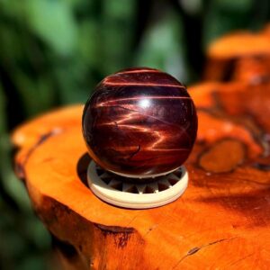 Red Tiger's Eye sphere with wooden stand - for confidence  & courage