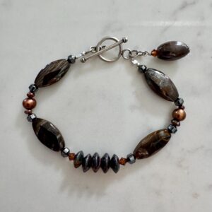 tiger iron, freshwater pearl, and hematite sterling silver bracelet.