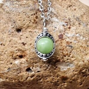 Tiny green calcite pendant. Reiki jewelry uk. Silver plated Wire wrap pendant. Minimalist Oval frame necklace
