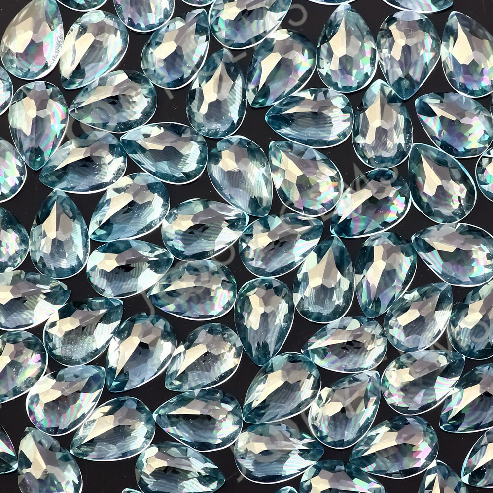 Sky Blue Topaz Rose Cut Pear Cabochon 6x4mm - Per Stone Sky Blue Topaz Rose Cut Pear Cabochon 6x4mm - Per Stone