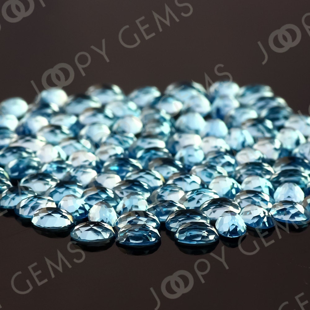 Swiss Blue Topaz Rose Cut Oval Cabochon 6x4mm - Per Stone Swiss Blue Topaz Rose Cut Oval Cabochon 6x4mm - Per Stone