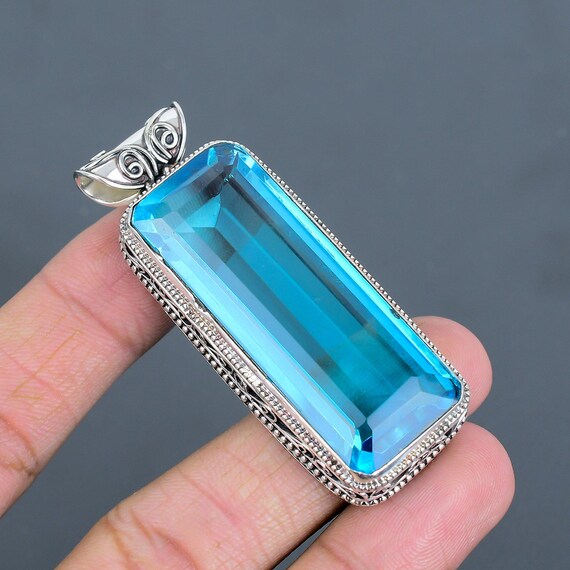 Faceted Swiss Blue Topaz Heart Pendant: 925 Sterling Silver Gemstone