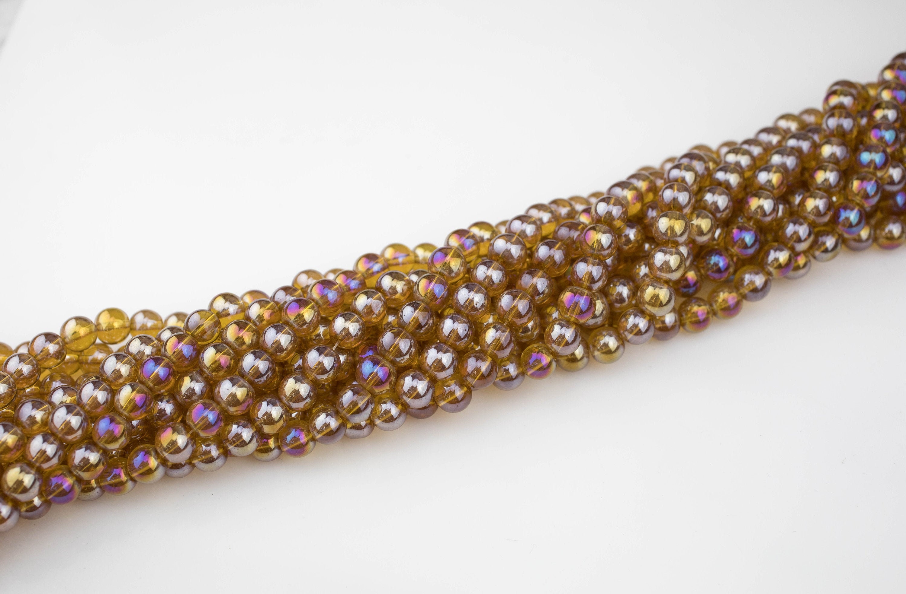 8mm Honey Topaz Ab Crystal Smooth Round - 2 Strands Or 10 Strands 8mm Honey Topaz Ab Crystal Smooth Round - 2 Strands Or 10 Strands
