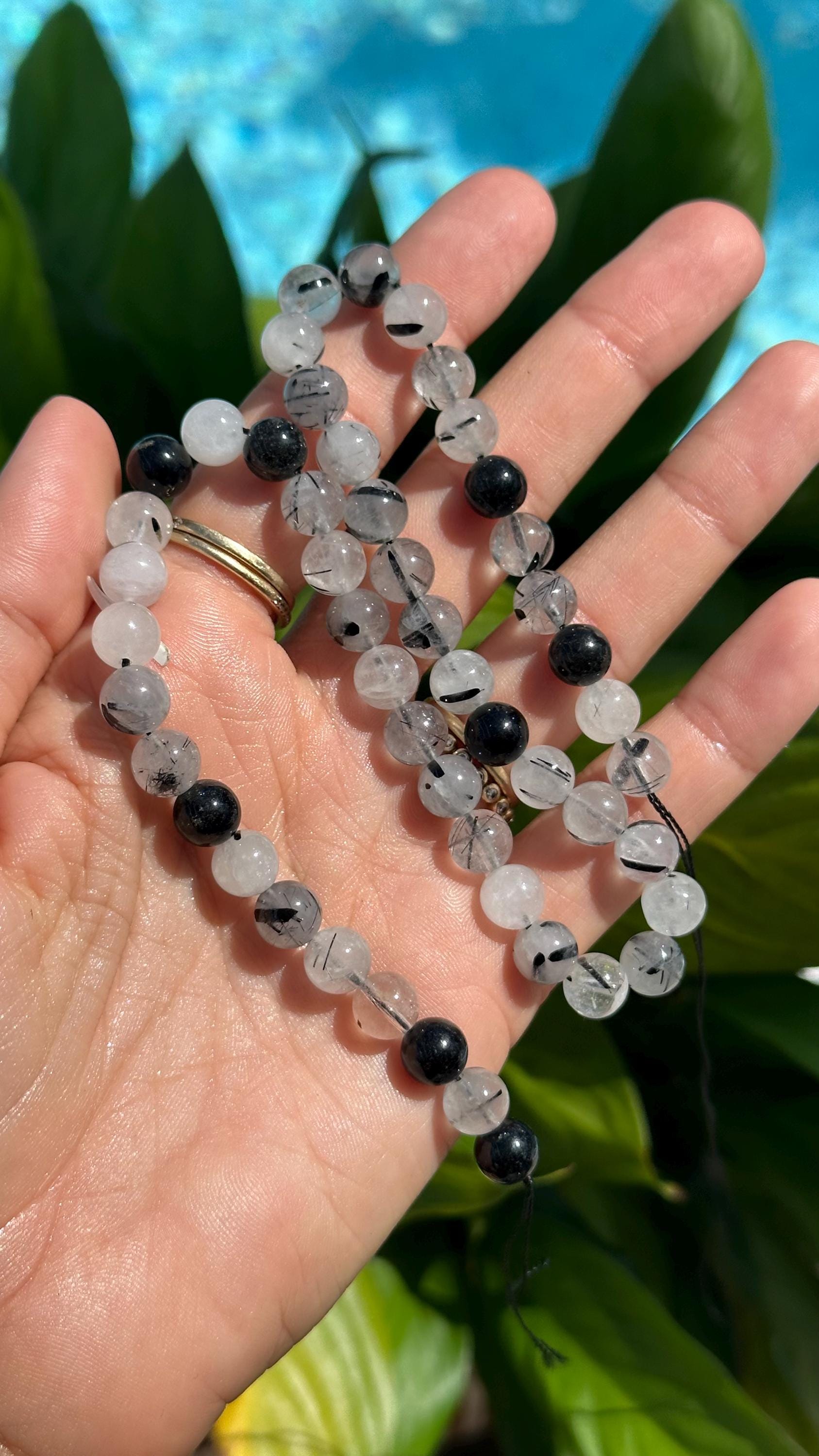Tourmalated Quartz Strand: 8mm Black And White Crystal Beads Tourmalated Quartz Strand: 8mm Black And White Crystal Beads