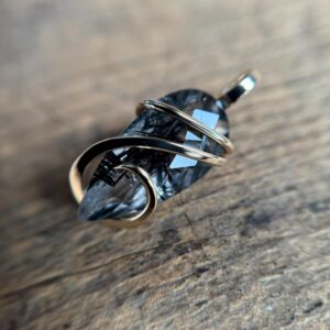 Faceted tourmalinated quartz in 14k gold pendant