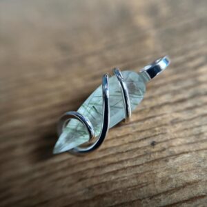 Faceted tourmalinated quartz in sterling silver pendant