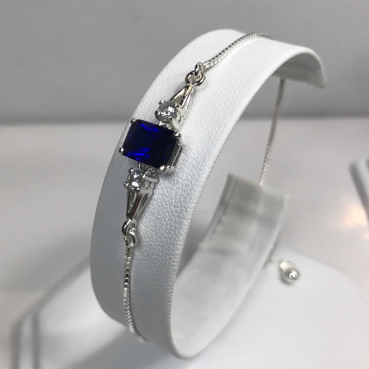 4ct Emerald Cut Sapphire Bracelet In Sterling Silver With White Sapphire Accents Bolo