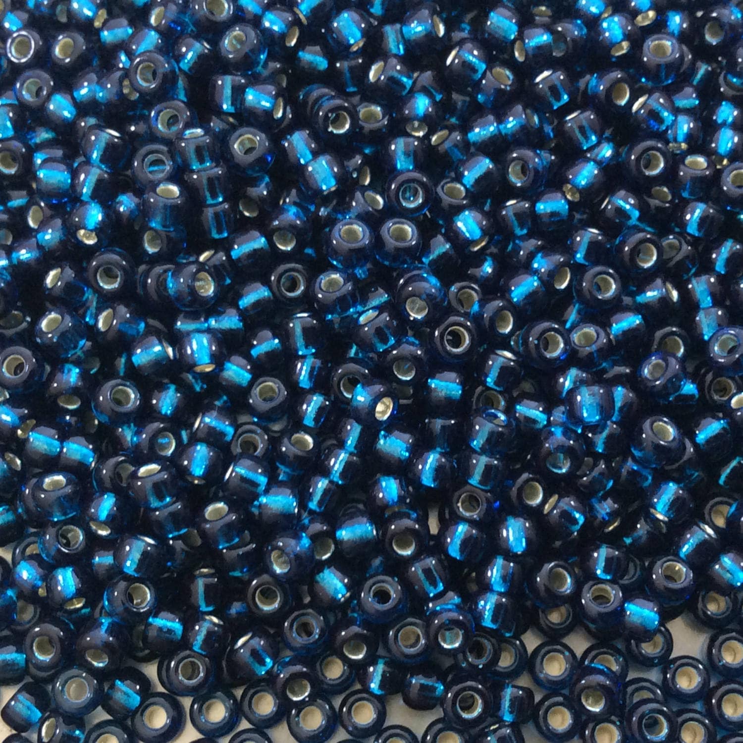 Miyuki 8 / 0 Seed Beads: Glossy Blue Zircon, Silver Lined (22 Gram Tube)