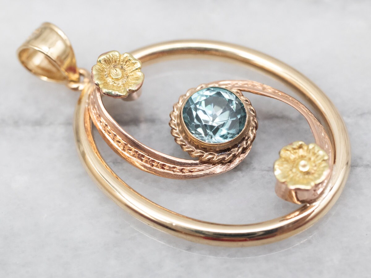10k Yellow & Rose Gold Blue Zircon Floral Swirl Pendant 10k Yellow & Rose Gold Blue Zircon Floral Swirl Pendant