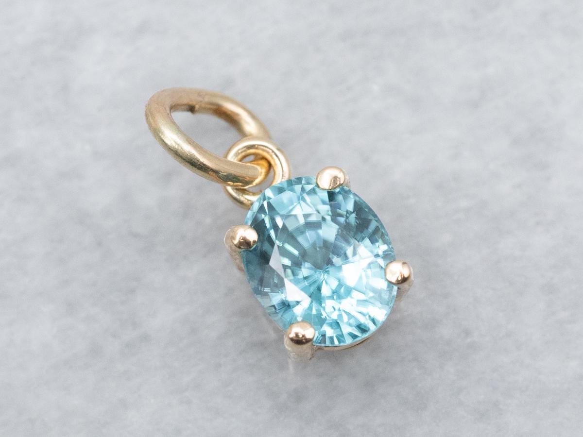 14k Yellow Gold Blue Zircon Oval Solitaire Pendant